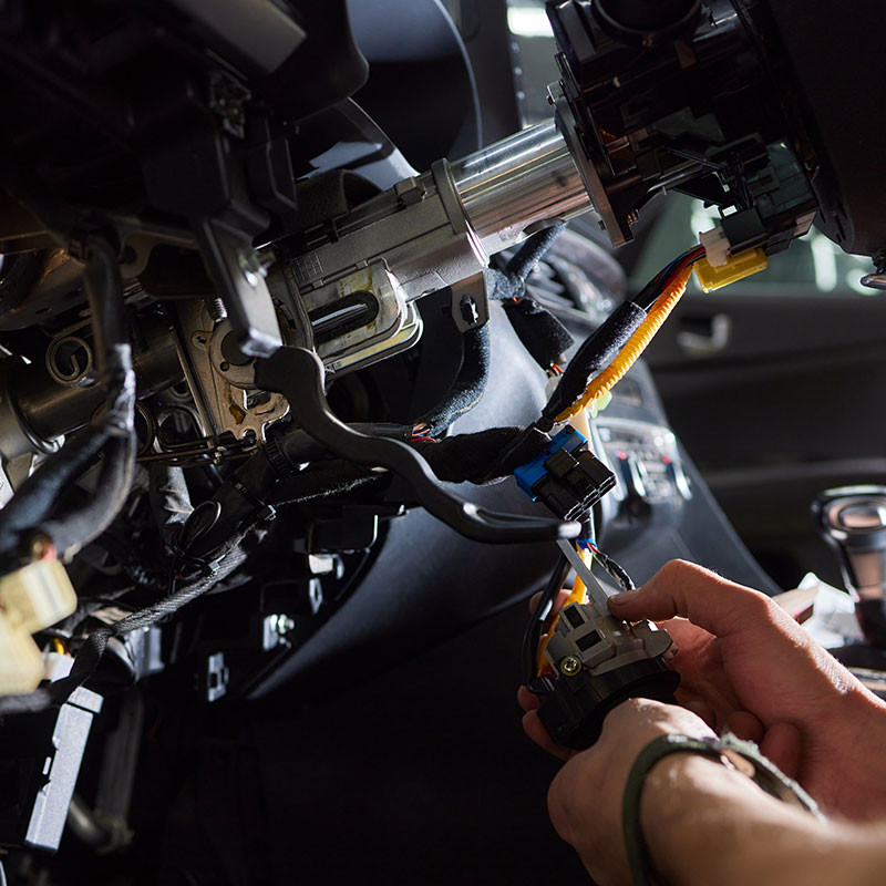 A car alarm being fitted in a car